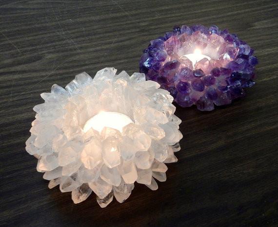 crystal quartz point candle holder next to an amethyst point candle holder