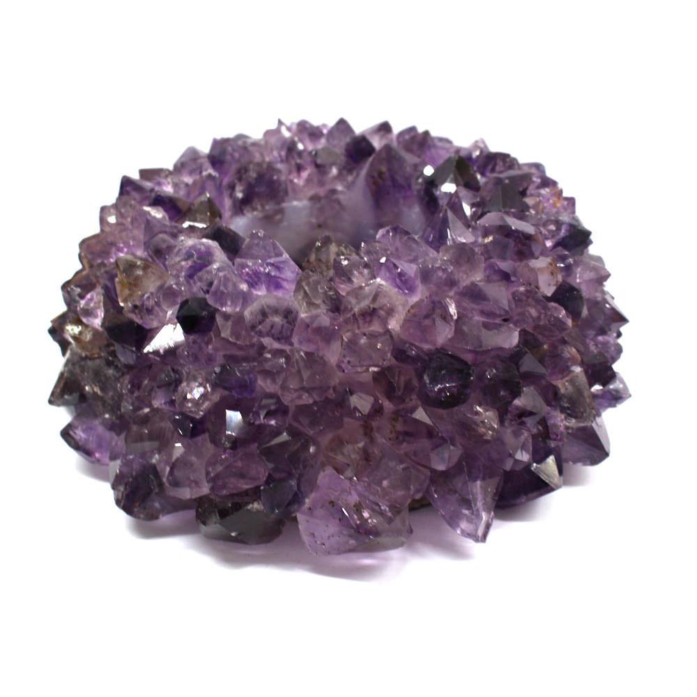 large amethyst point candle holder on white background