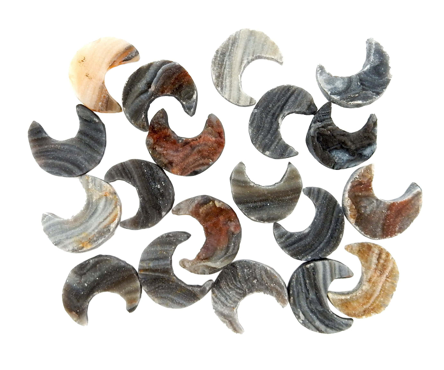 group of Raw Chalcedony Moon Crescents scattered on white background