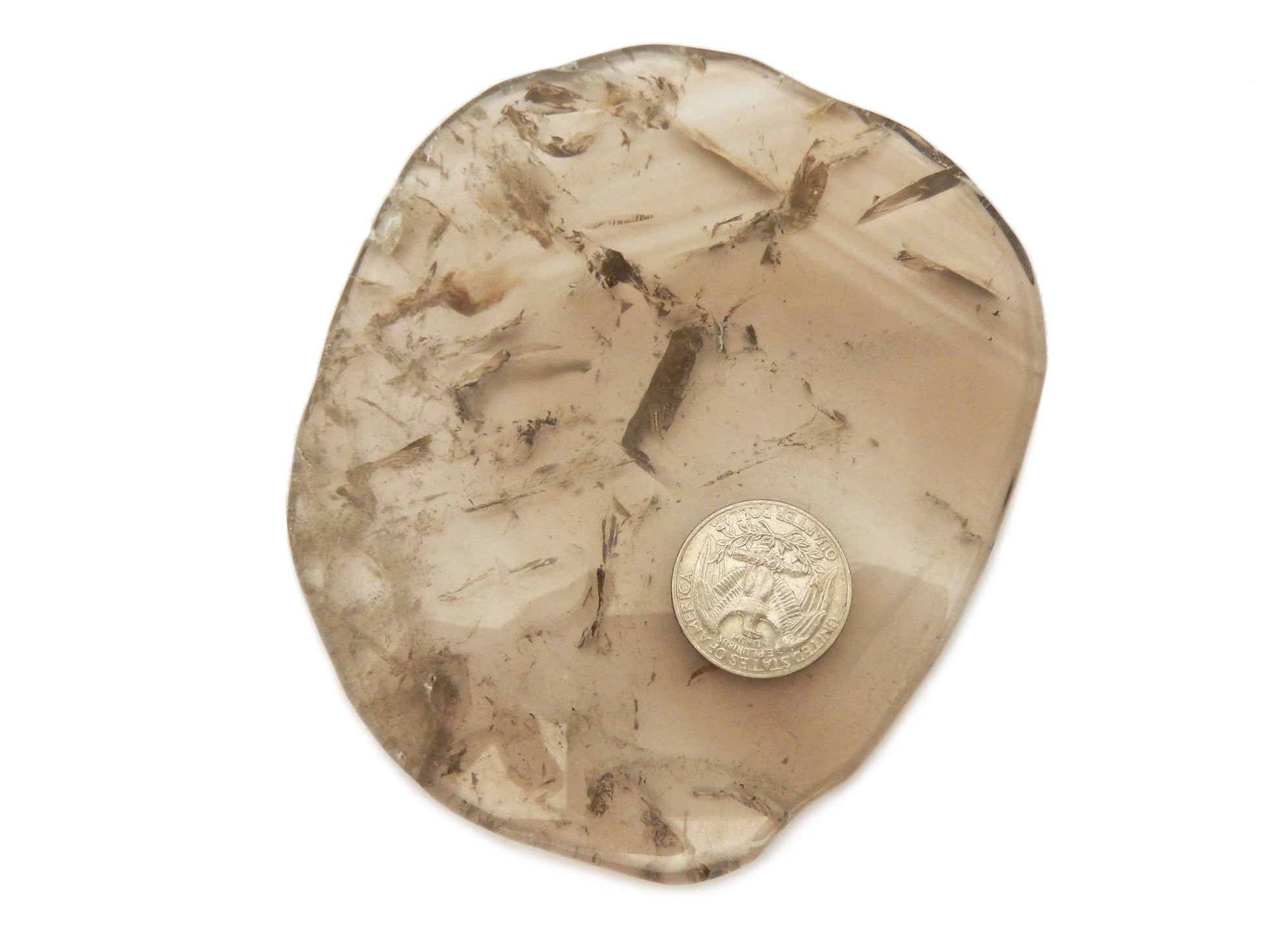 smokey quartz coaster with a quarter for size reference