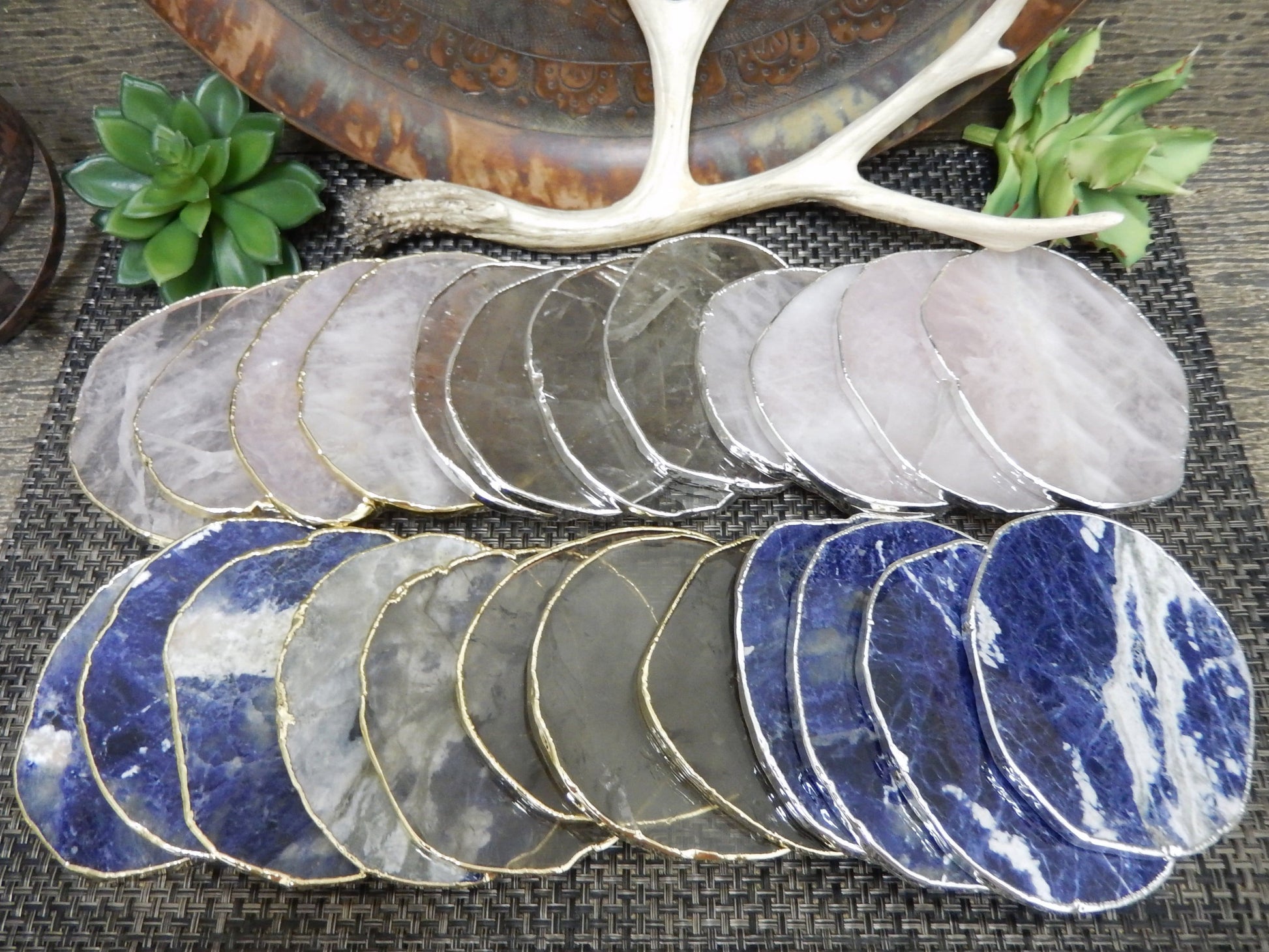 Stone Slices - Coaster Size in smoky quartz, sodalite, and rose quartz laid out on a table