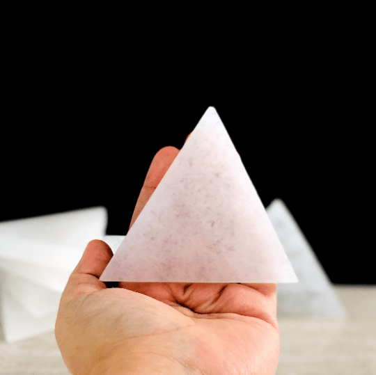 selenite triangle charging plate in hand for size reference
