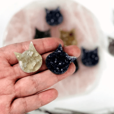 Natural Druzy Cat Cabochon held on fingers