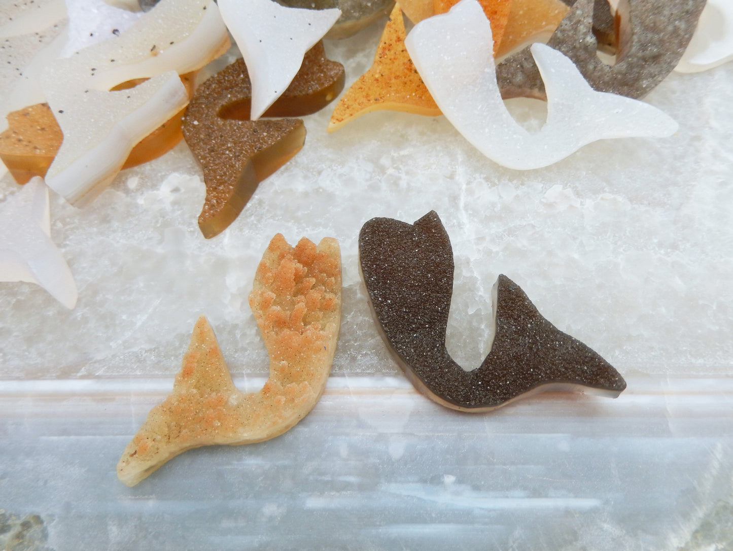 Druzy cluster mermaid tail cabochon up close to show texture differences between each tail