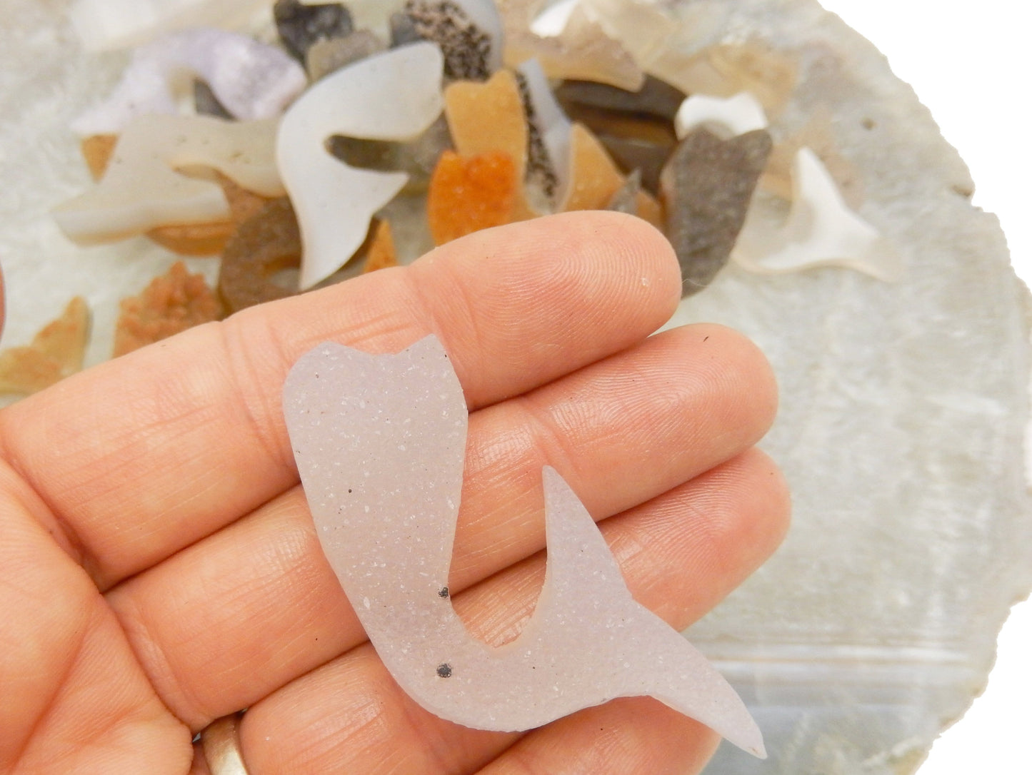 Druzy cluster mermaid tail cabochon in hand for size reference