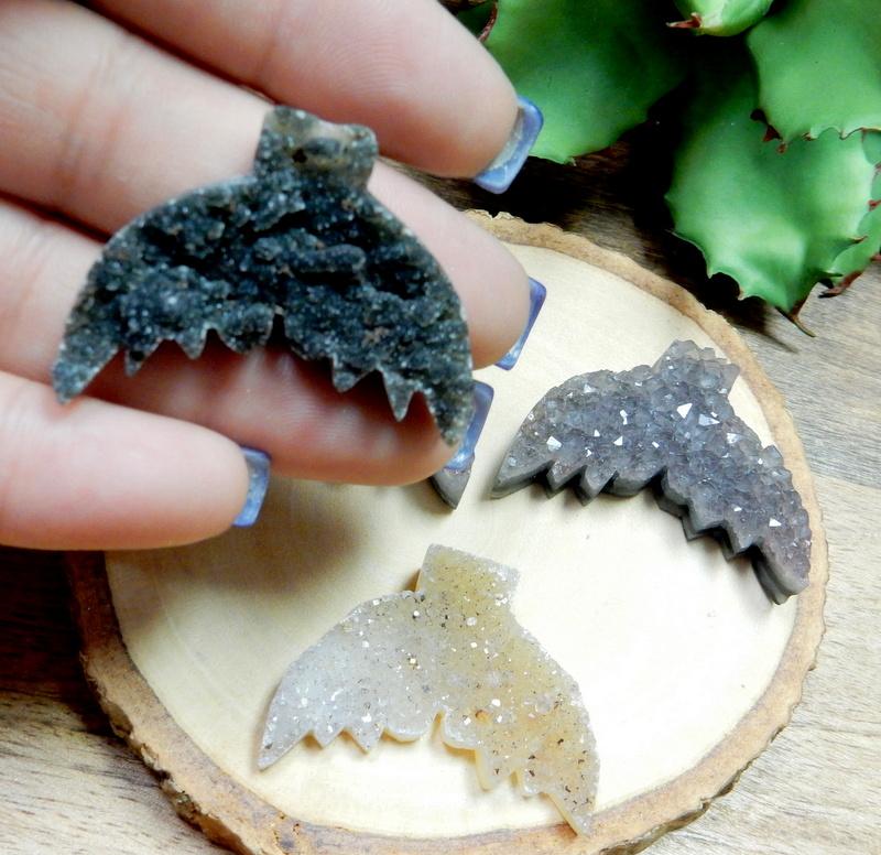 druzy mermaid tail in a hand