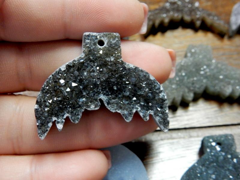 one druzy mermaid tail in a hand