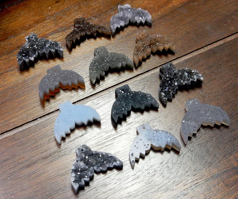 druzy mermaid tails in 4 rows on a table