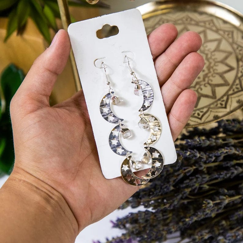 Triple Moon with Gemstones Earrings with Clear Quartz stones and Electroplated Silver Finish in a hand for size reference