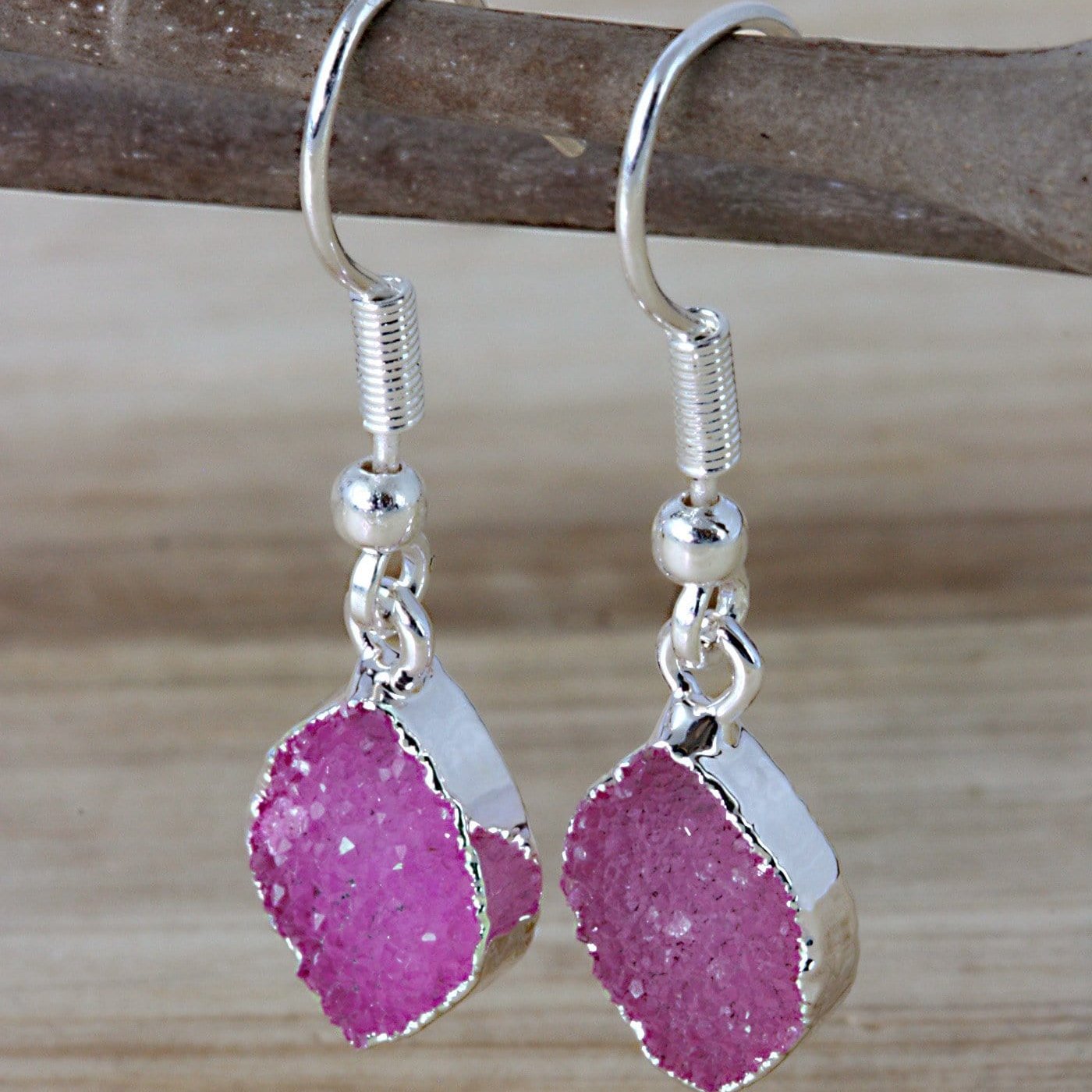 pink marquise earrings on a branch