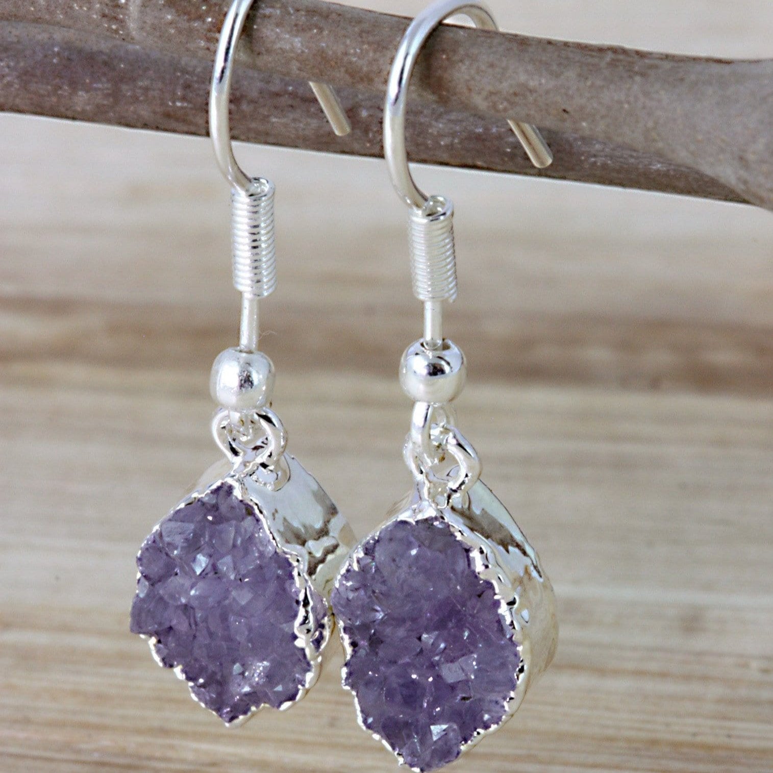 amethyst marquise earrings on a branch