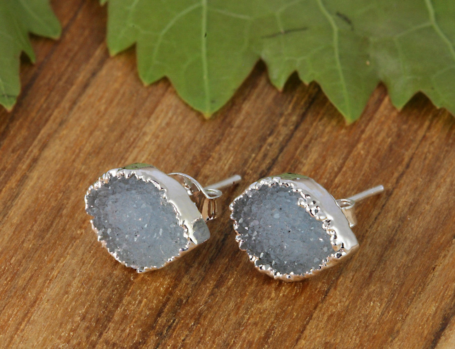 one pair of earrings on a table - white