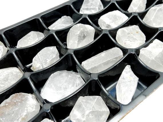 crystal quartz by the box on white background