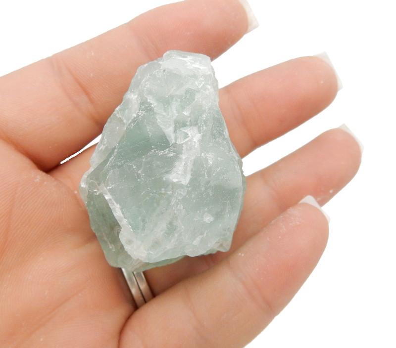 Green Fluorite crystal on hand for size comparison 