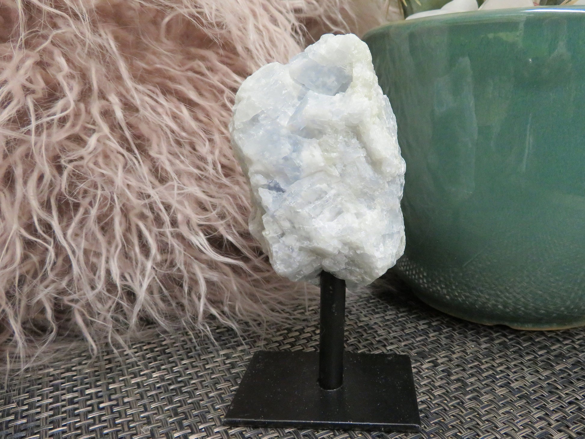 blue calcite on metal stand close up