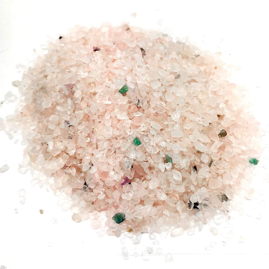 Pile of Rose Quartz Tiny Chip Stones on white background