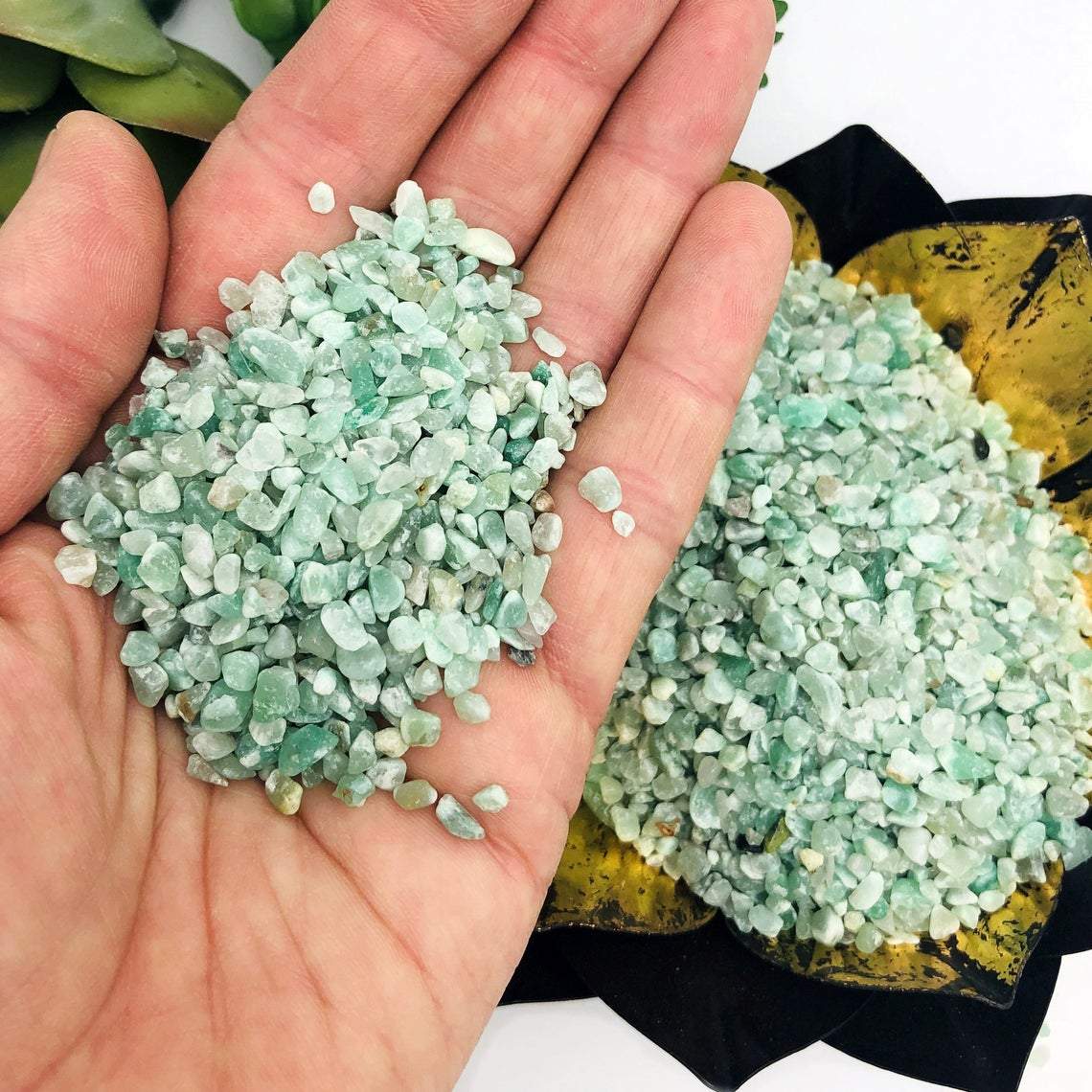 Green Quartz Tiny Chip Stones with some in a hand for size reference