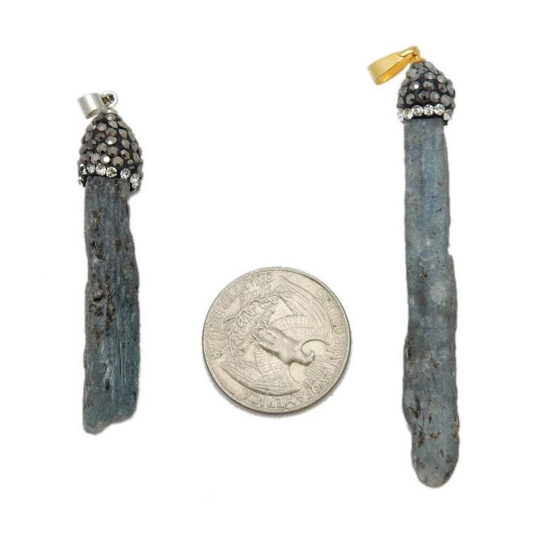 pendants next to a quarter for size reference 