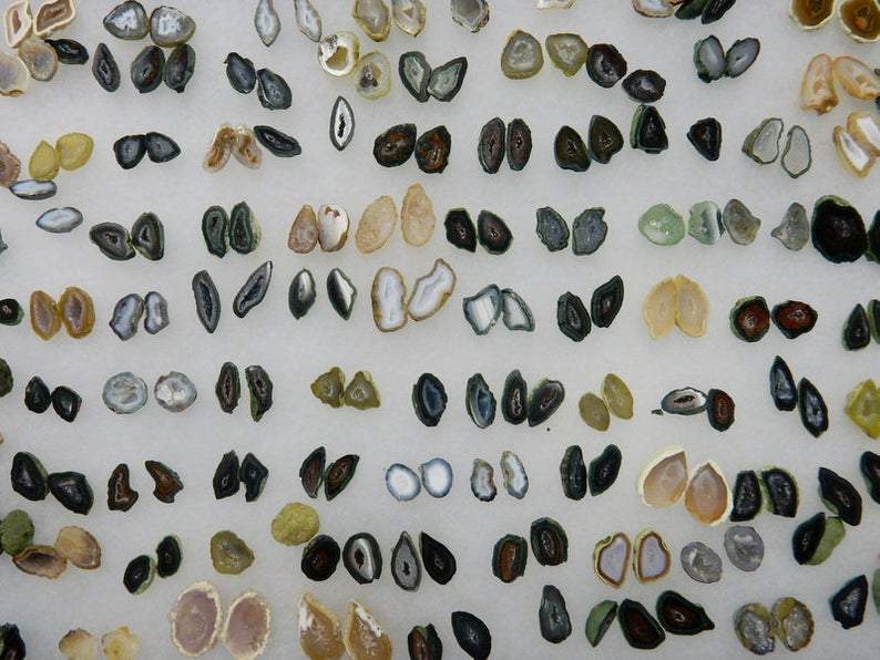 Geode Druzy Pairs laid out to show varying colors of greys, tans, browns, blacks, whites