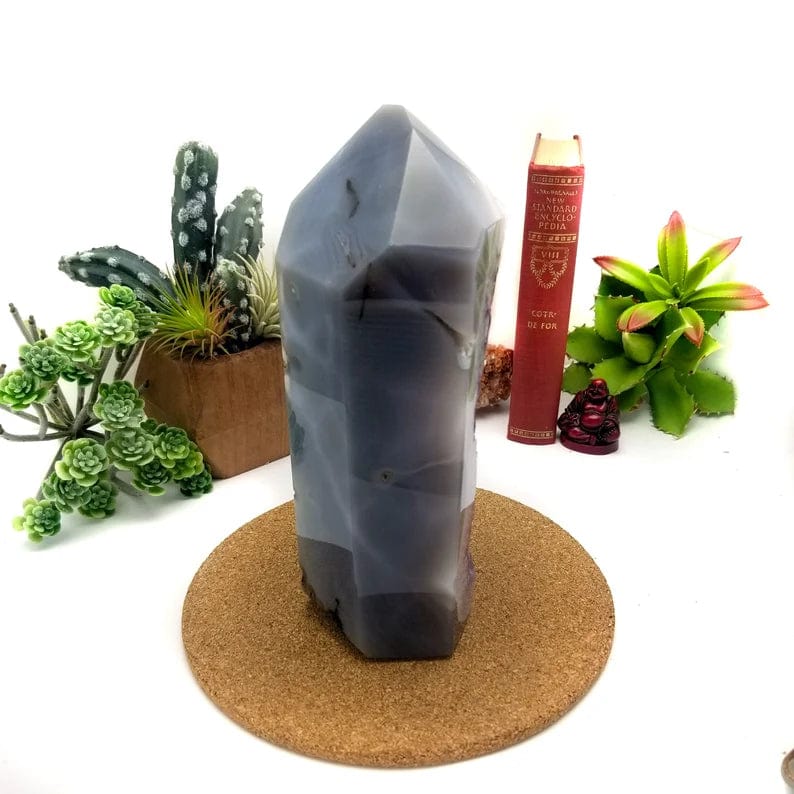 Side view of the cut base showing gray agate banding on the side and back.