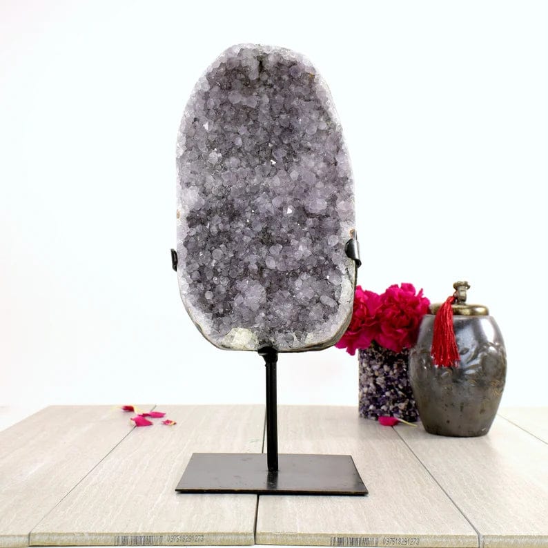 Amethyst Crystal Purple Geode on Metal Stand  on display