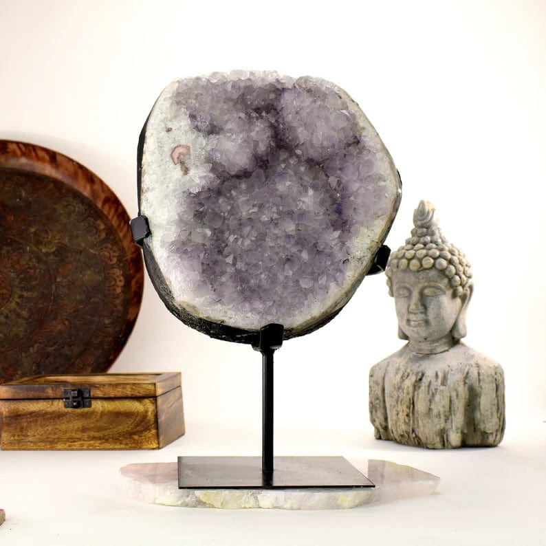 Amethyst Crystal Purple Geode on Metal Stand on display