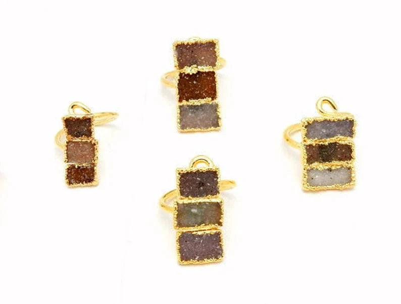 4 Triple Rectangle Druzy with Electroplated 24k Gold Edges on an Adjustable 24k Gold Electroplated Rings showing varying colors of white, tan brown, greys, darks, lavenders