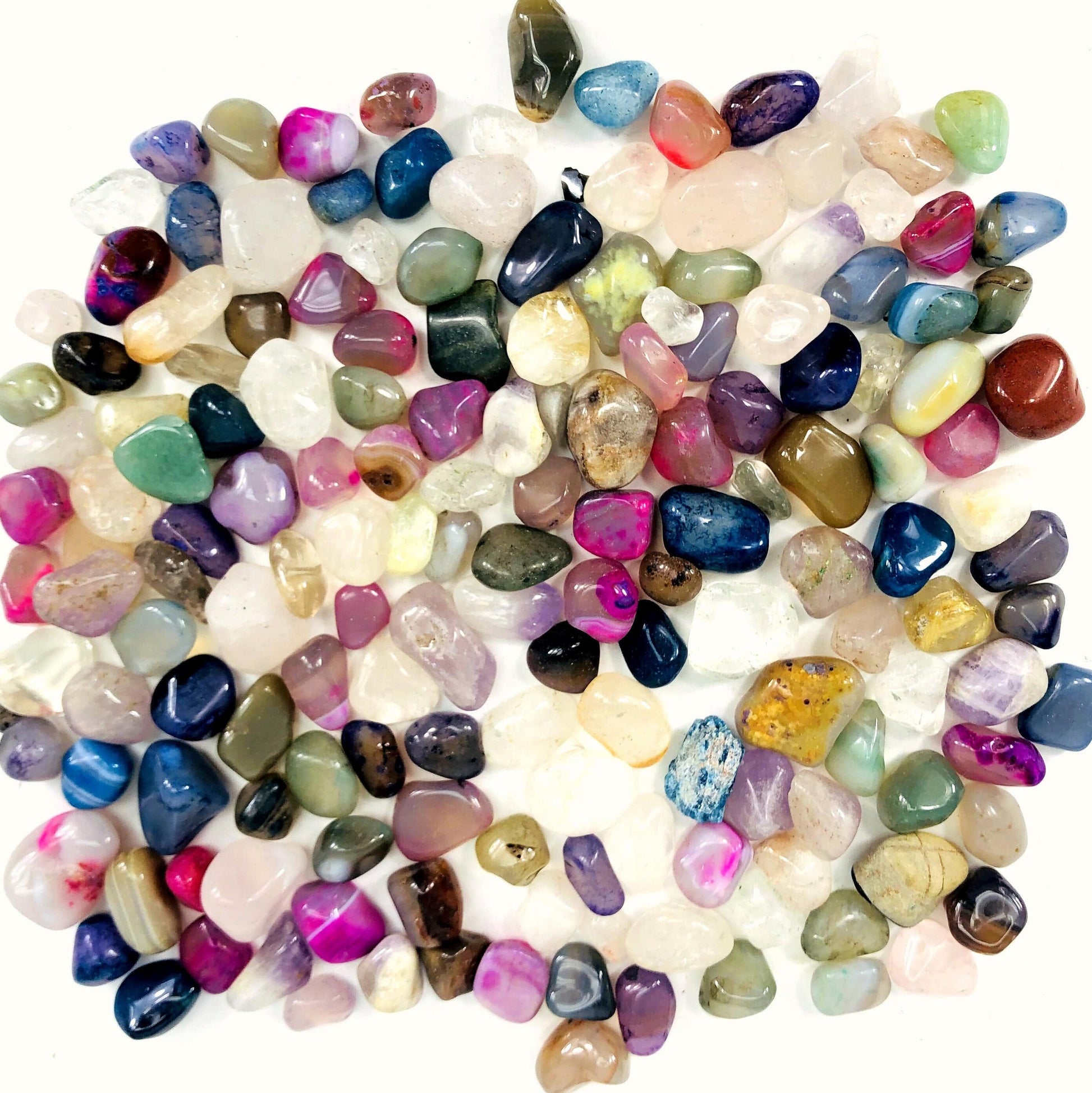 Mixed Small Tumbled Crystals Gemstones Bag a pile of crystals on a white background