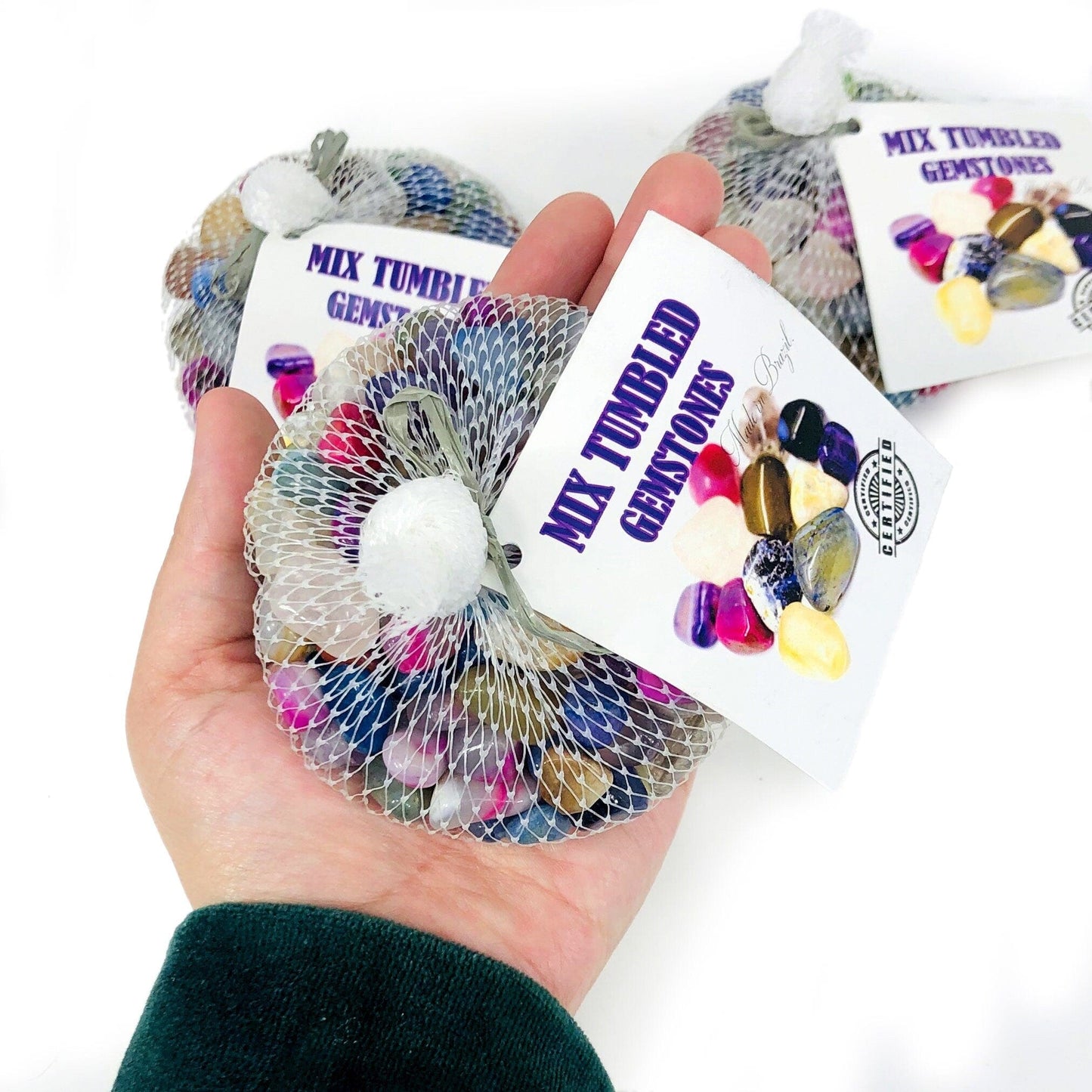 Mixed Small Tumbled Crystals Gemstones Bag top view in hand for size reference