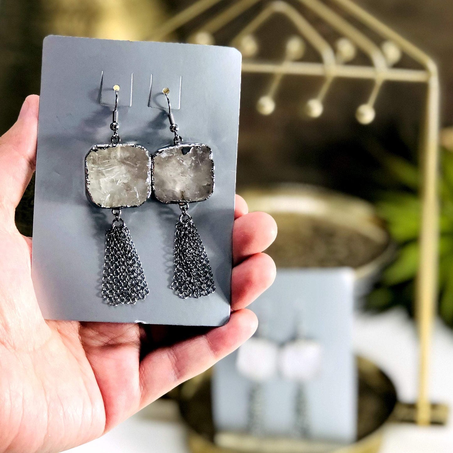 earring pair in hand for size reference 