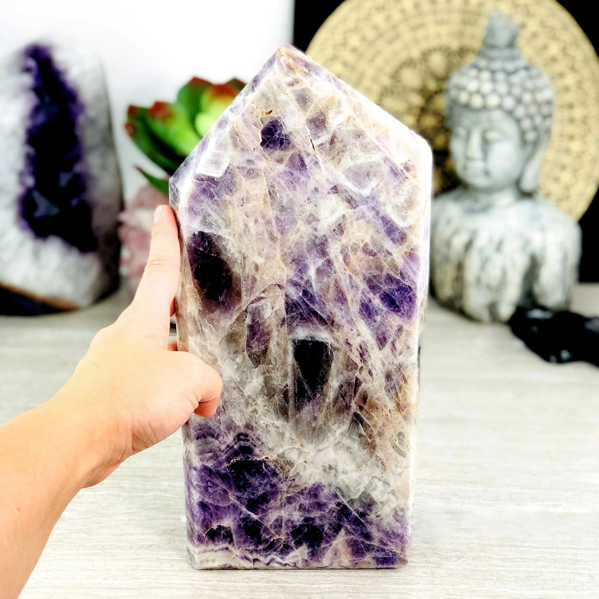 Chevron Amethyst Polished Point Cut Base - One-of-a-Kind with hand for size reference