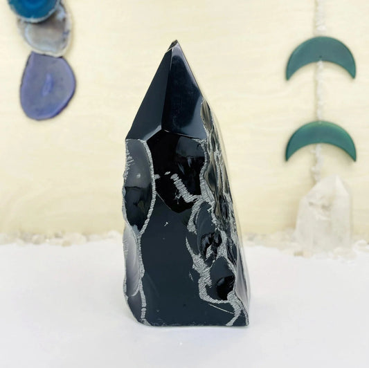 obsidian with decorations in the background