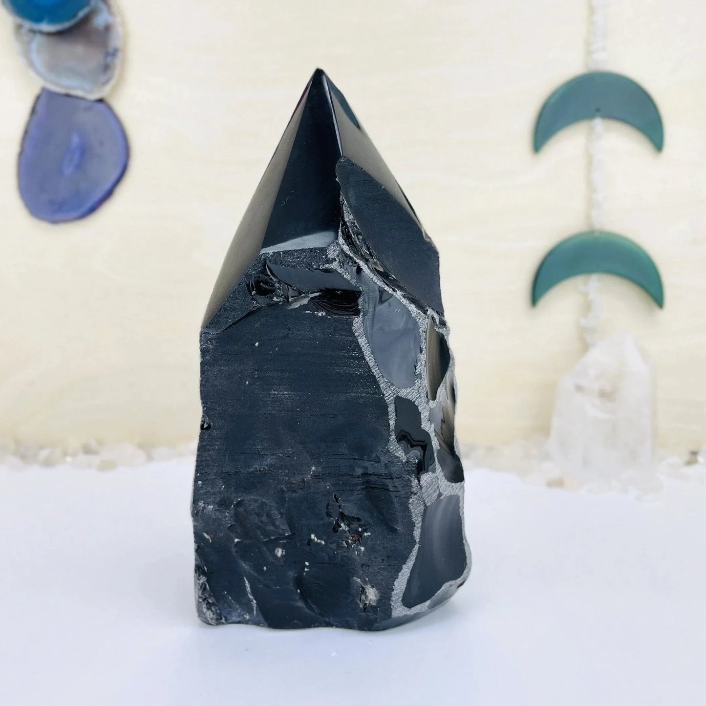 obsidian with decorations in the background