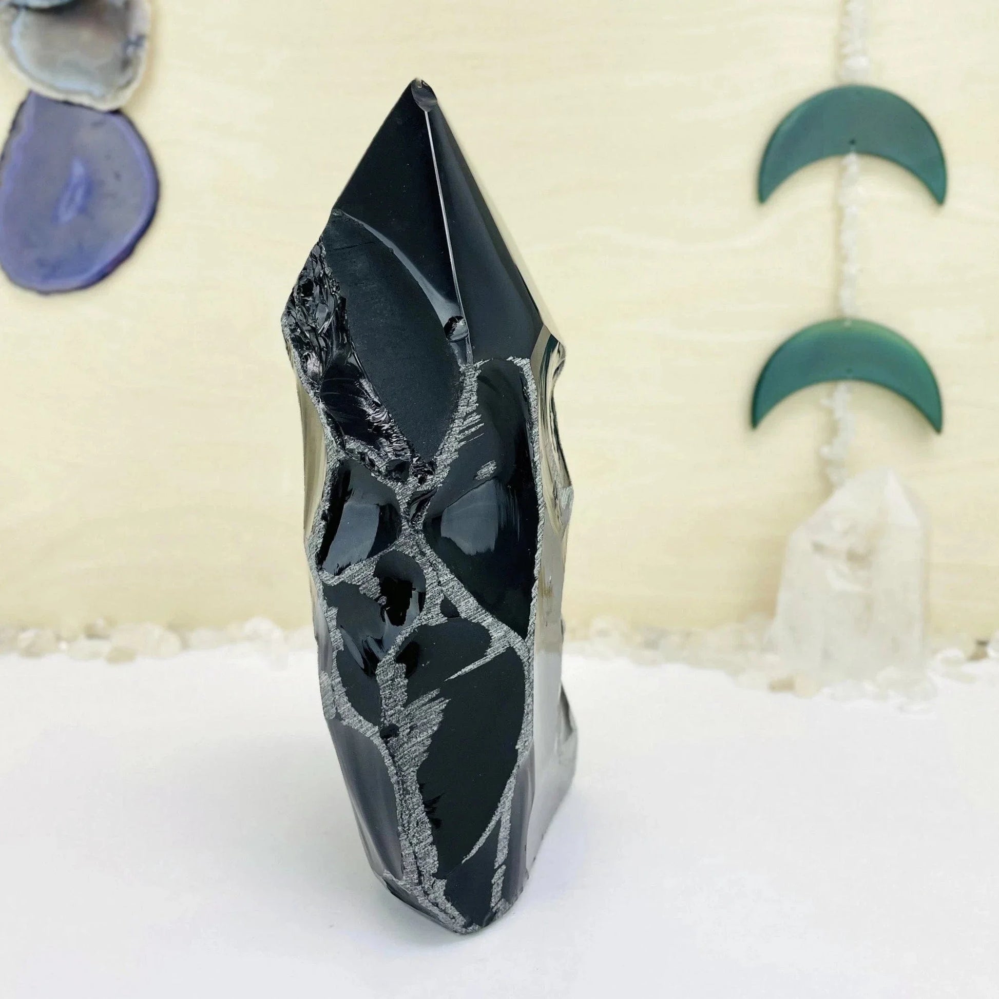 obsidian with decorations in the background