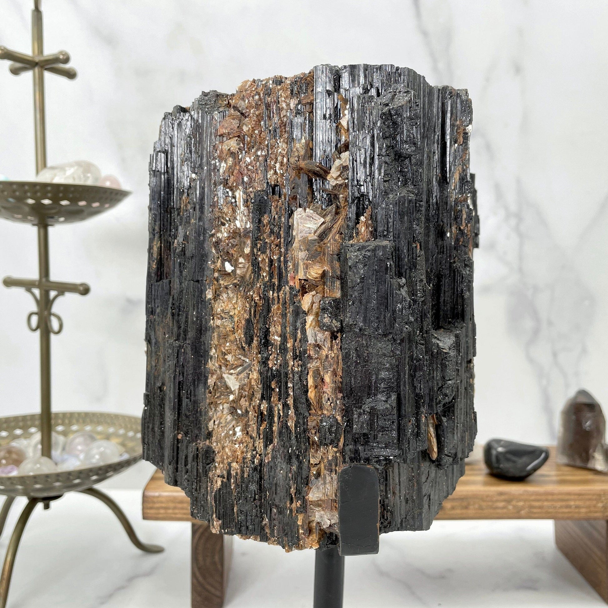 tourmaline with decorations in the background
