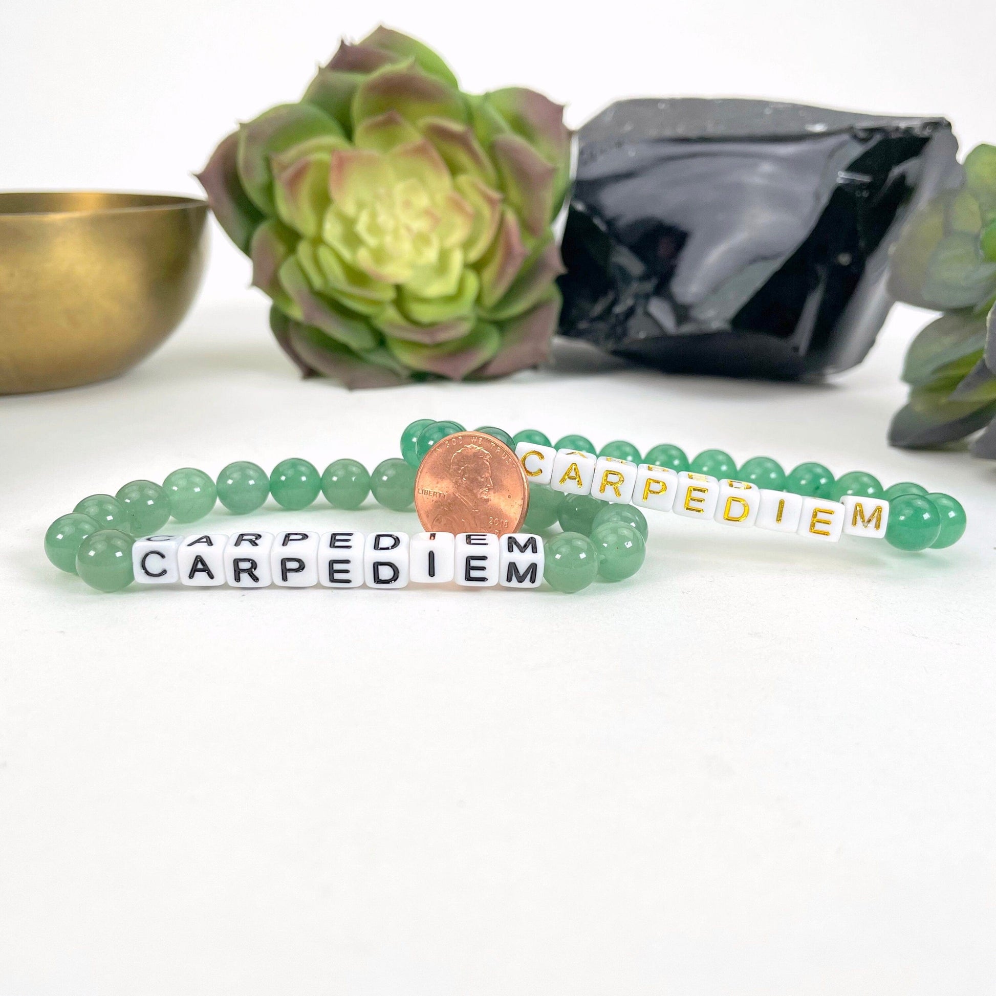 green aventurine Crystal Mala Bead Bracelet - CARPE DIEM  next to a coin for size reference