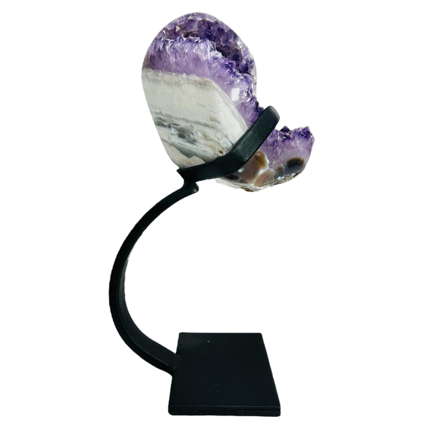 side view of amethyst with stand on white background