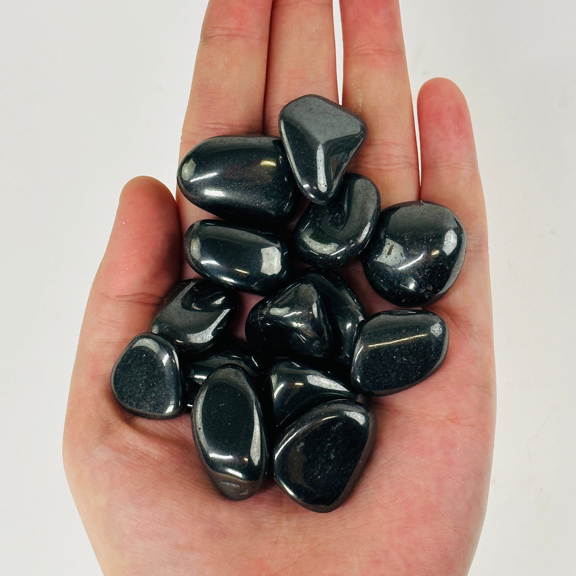 silver hematite in a hand.