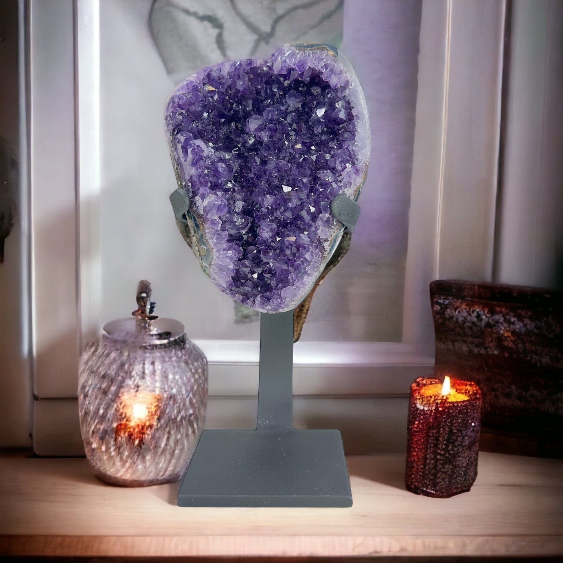 amethyst on stand with decorations in the background