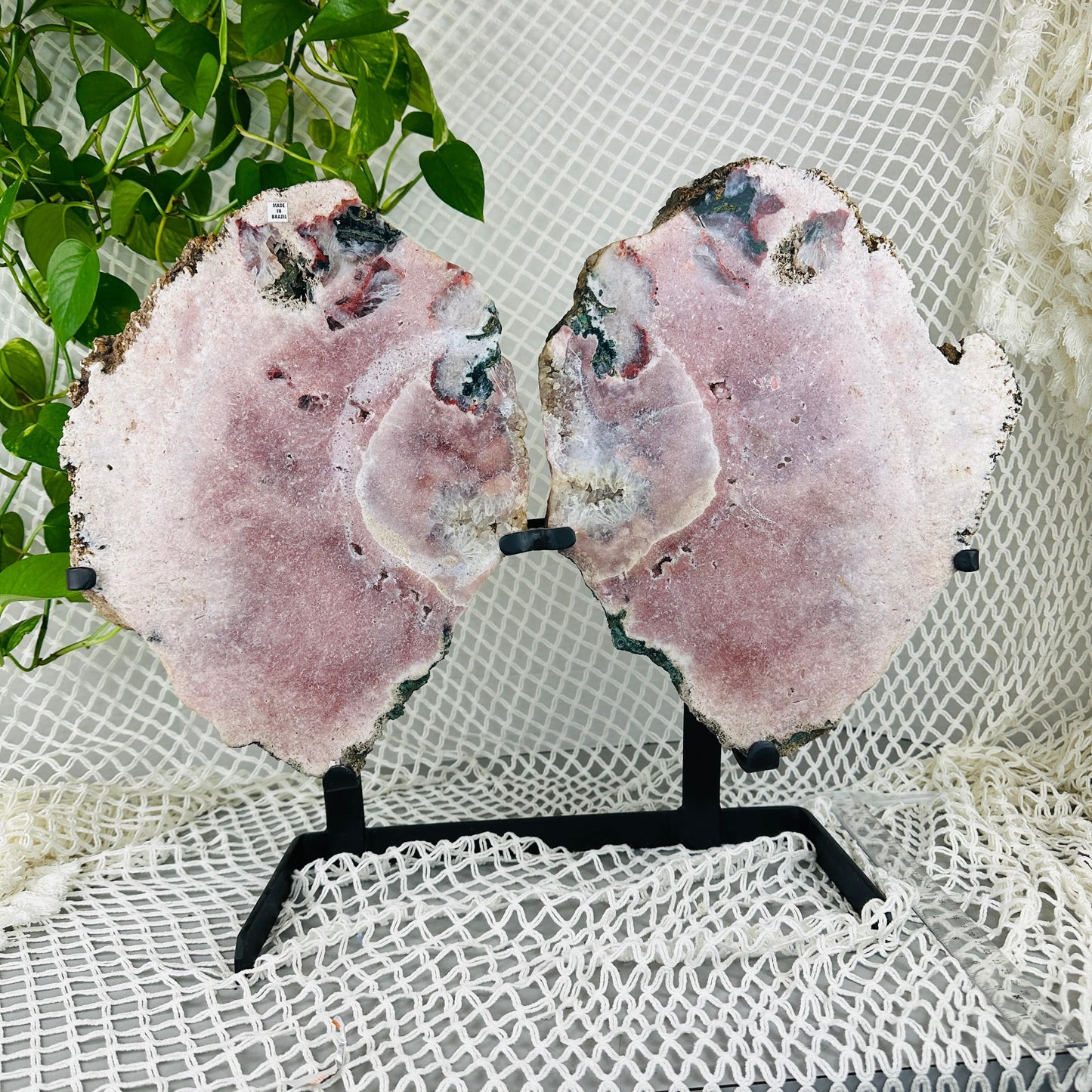 Pink amethyst wings with decorations in the background