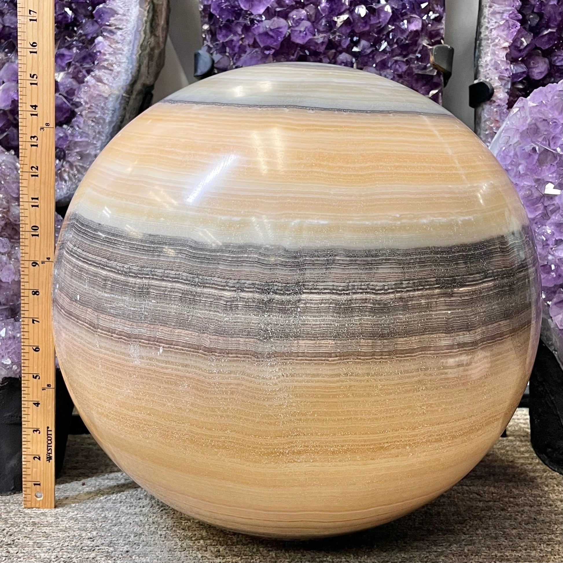 Mexican Onyx - Colossal Polished Sphere Option A pictured next to a yard stick for size reference.