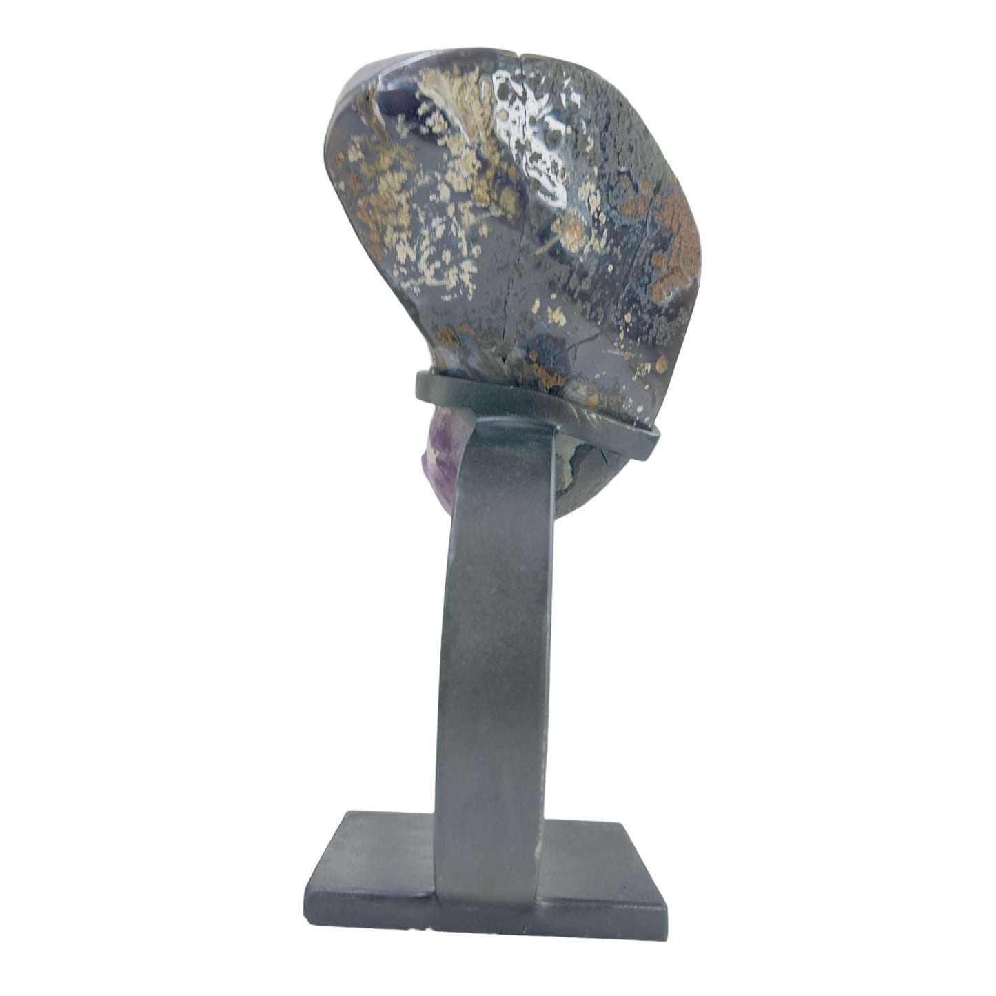 backside of amethyst on stand on white background