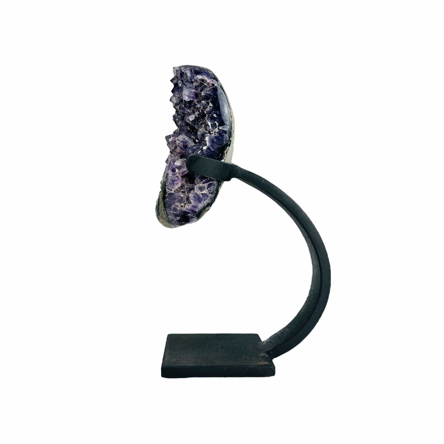 side view of amethyst with stand on white background