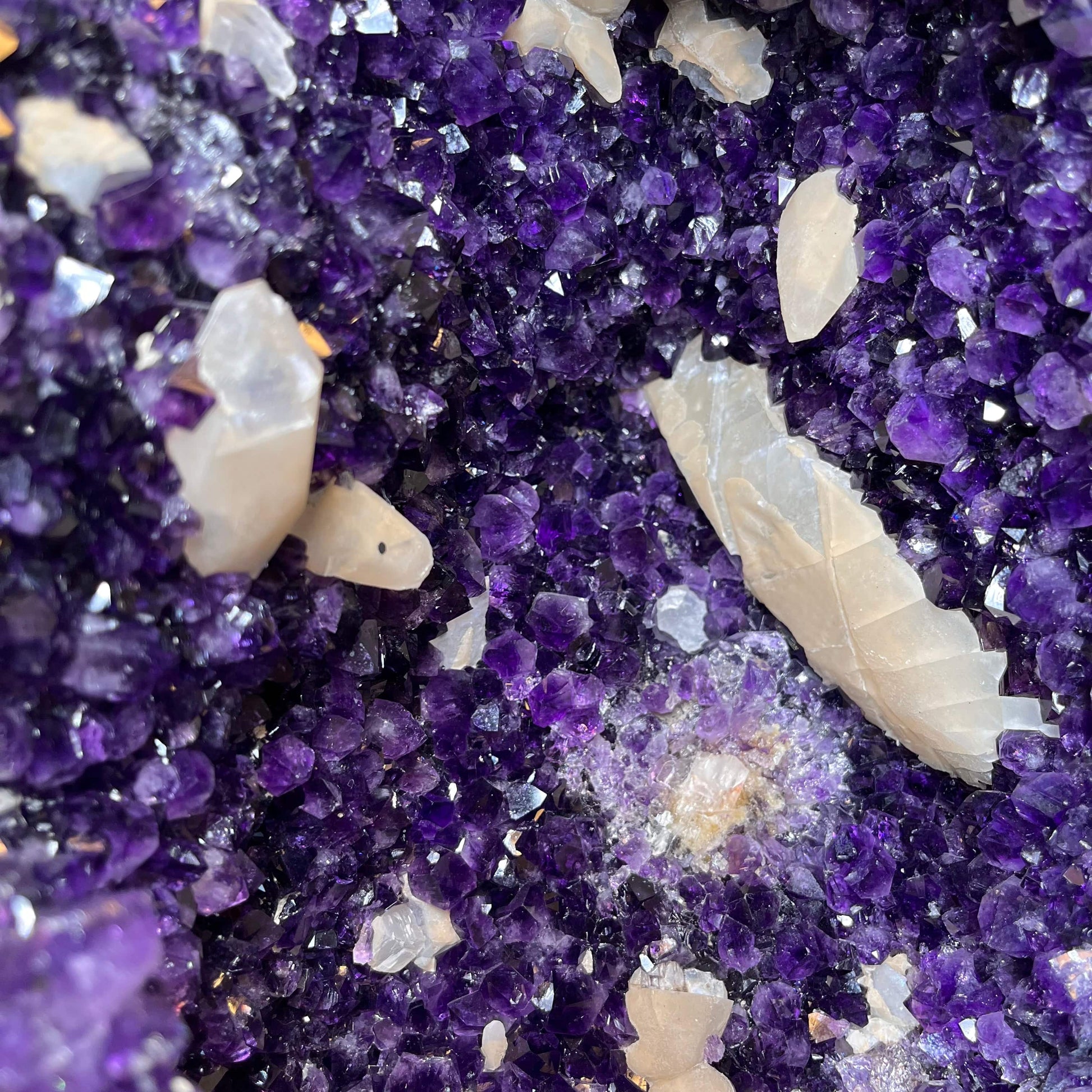Up close view of crystal formations inside Large Dark Purple Amethyst and Calcite Geode.