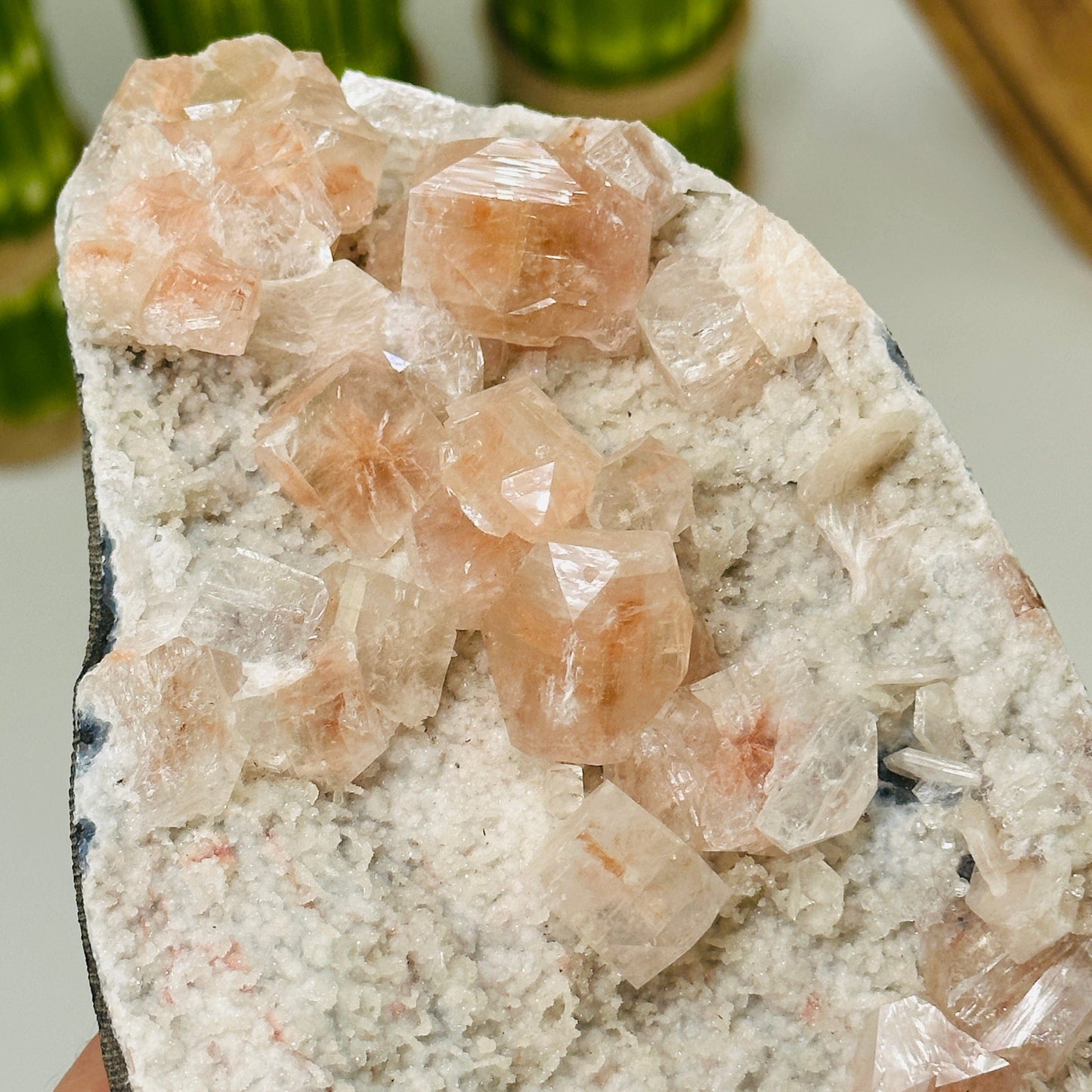 up close shot of peach apophyllite on matrix
