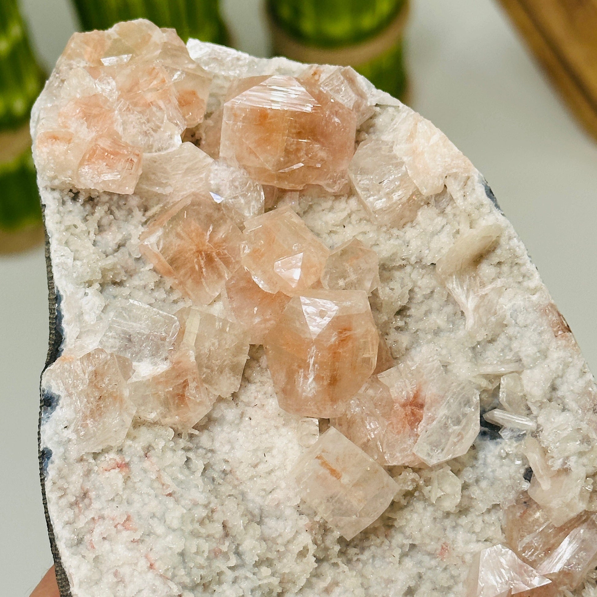 up close shot of peach apophyllite on matrix