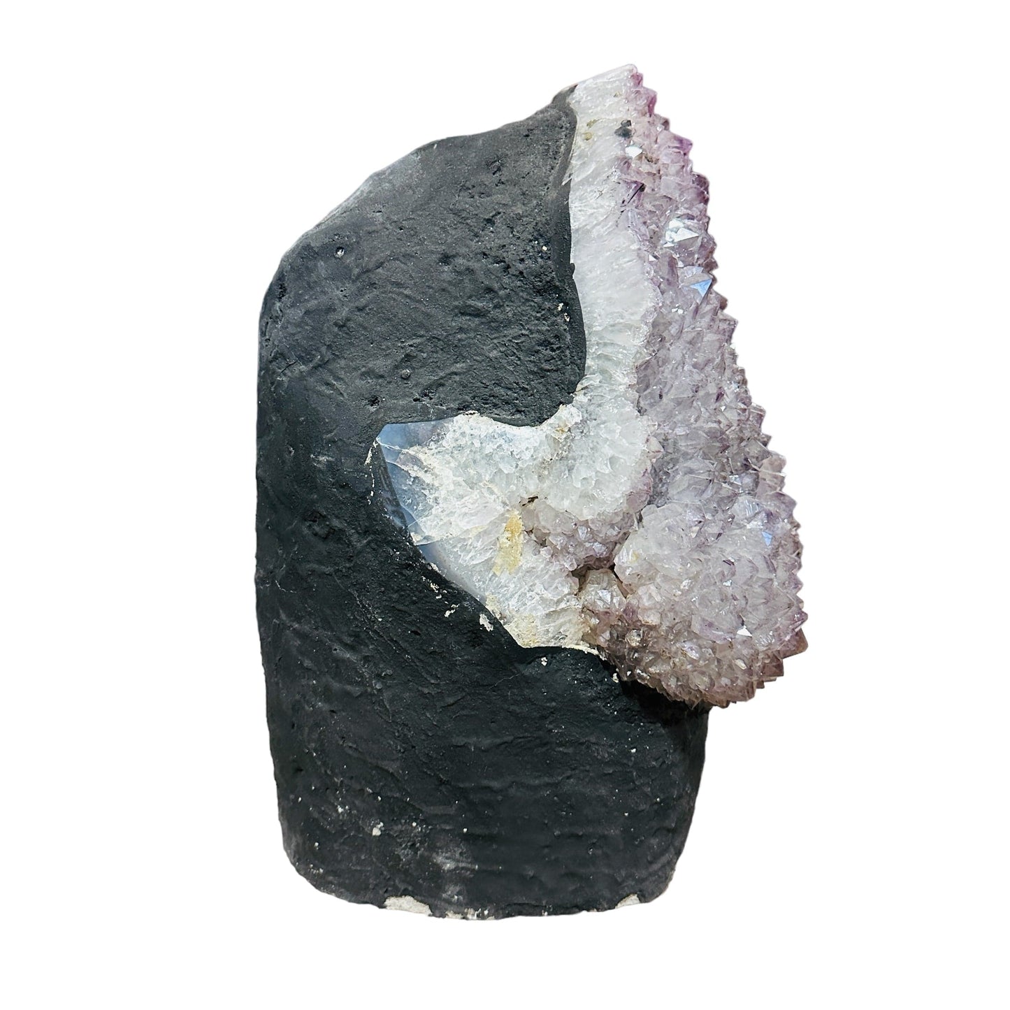 side view of amethyst decoration on white background