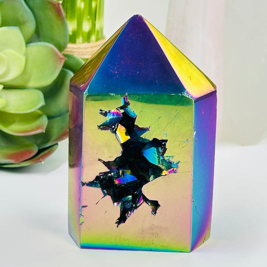 rainbow titanium druzy point with decorations in the background