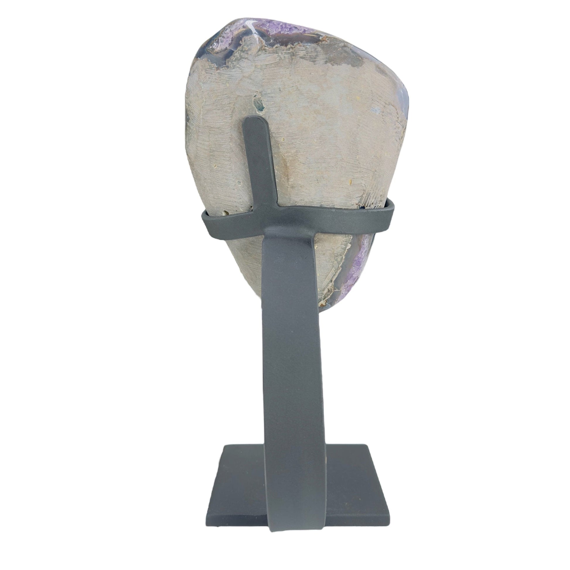 backside of amethyst on stand on white background