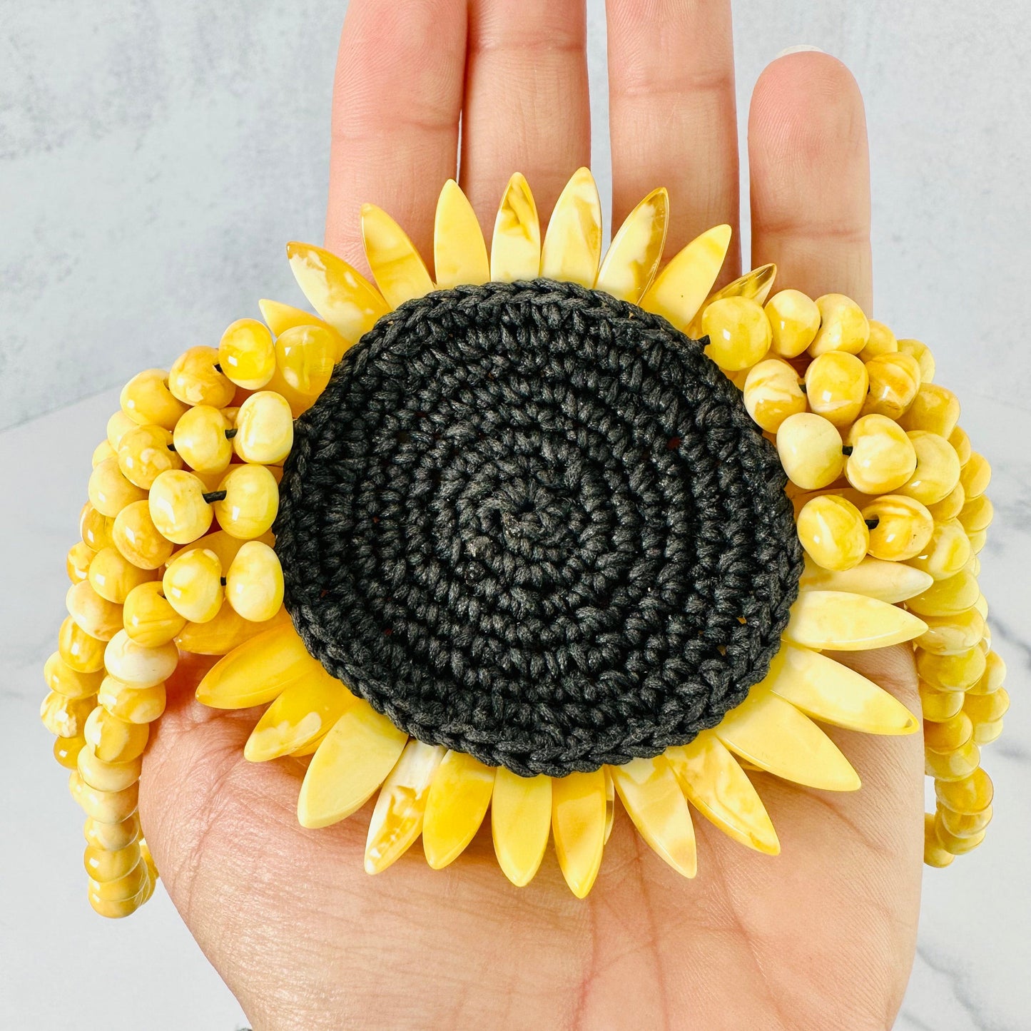 Back view of the crochet patch holding together the flower on the Baltic Amber Beaded Flower Necklace.